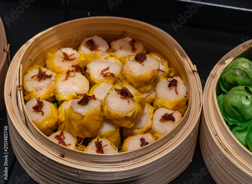Fresh, handmade steamed dumplings on display ready for sale.