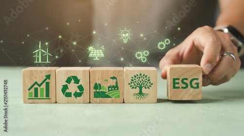 ESG Sustainability Strategy Concept with Environmental Icons on Wooden Blocks Held by Business Professional Hand