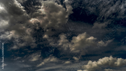 Fotografie Dark rain cloud dramatic sky summer tropical thunder storm sky and fluffy black darkness cloud nearly raining cloudscape