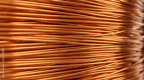 Macro close up of tightly stacked raw copper wires and electrical cables, industrial metallic texture and abstract material background