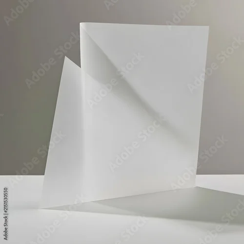 Fototapeta samoprzylepna Folded sheet of translucent vellum paper with geometric shadow