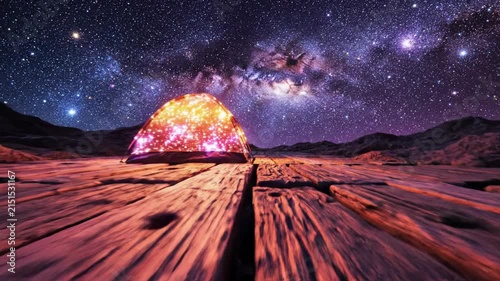 Milky Way galaxy over rocky desert landscape.
