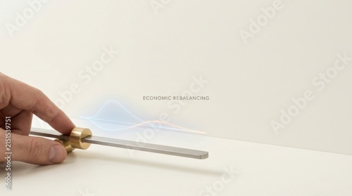 Person cutting a piece of brass counterweight to illustrate economic rebalancing and material adjustment