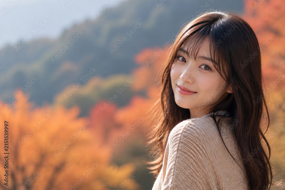 Fototapeta premium 美しい紅葉を背景に微笑む若い女性 Generative AI