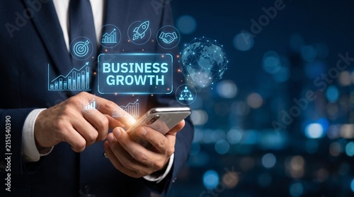Businessman using a modern smartphone to access business growth analytics and digital strategy data in a futuristic virtual office environment