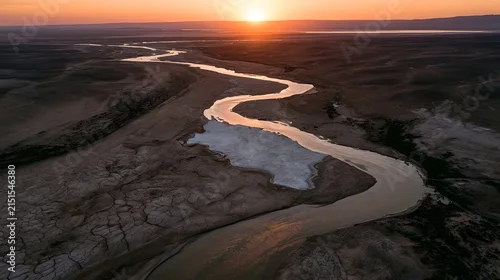 Fototapeta samoprzylepna Winding Desert River at Sunset with Salt Flat