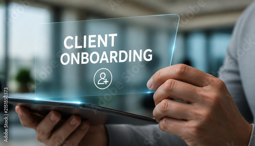 Professional holding transparent digital tablet displaying client onboarding text in modern bright corporate office setting