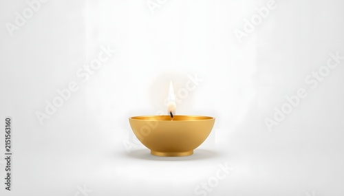 Golden brass diya lamp with flickering flame for Diwali festival celebration and spiritual rituals