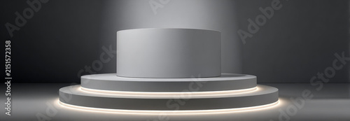 Minimalist studio display with circular platform and soft lighting for product presentation or showcase