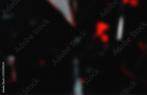 фотографія Blurry red digital number three on dark screen