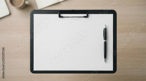 Blank clipboard with black pen on wooden desk workspace for professional notes