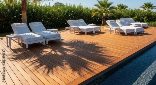 Luxury Resort Poolside Loungers Amidst Tropical Greenery And Sunlight