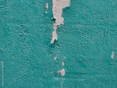 Canvastavla A textured turquoise painted wall features a prominent vertical strip of peeling
