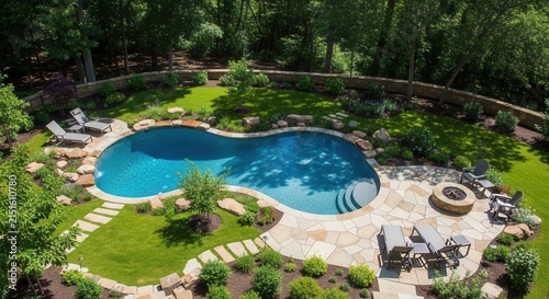 Luxurious Backyard Oasis With Freeform Pool And Fire Pit Seating Area