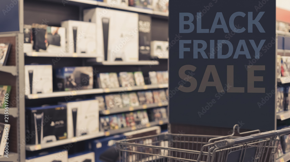 Obraz premium Shopping cart in electronics store with Black Friday sign