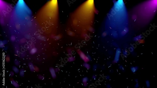Colorful Stage Spotlights with Floating Particles on Black Background