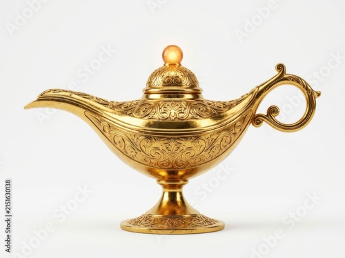 An Ornate Golden Genie Lamp Featuring Intricate Engravings And A Glowing Finial