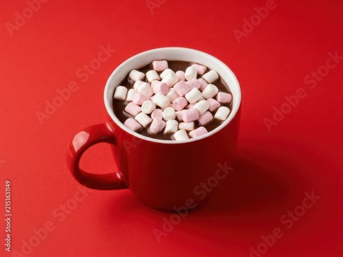 A Vibrant Red Mug Filled With Rich Hot Chocolate And Mini Marshmallows