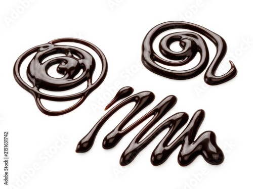 Three distinct artistic swirls and patterns made from rich glossy dark chocolate