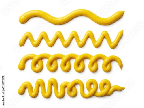 Four distinct patterns of yellow mustard sauce squeezed onto a white background