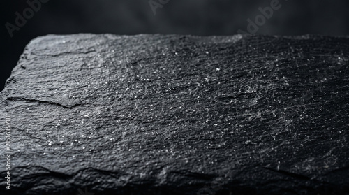 Black slate stone texture background. Dark natural rock surface for product display.