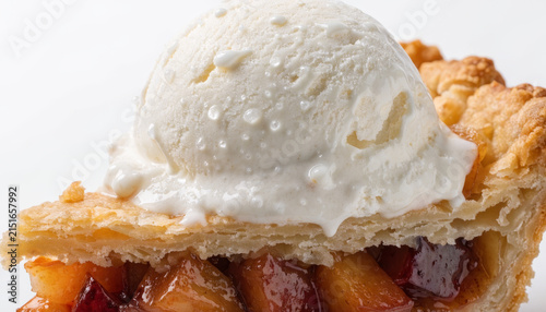 Slice of apple pie vanilla ice cream flaky crust baked apple dessert sweet close up golden brown homemade delicious comfort food indulgent treat classic American baked fruit creamy snack rustic