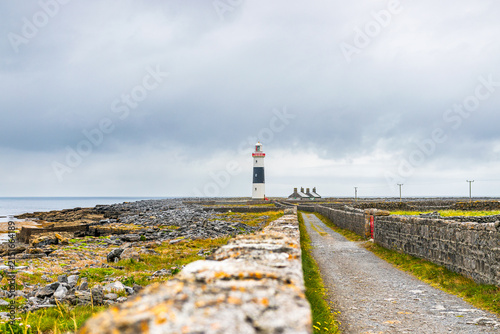 Lighthouse and stone walled road on Inisheer, Aran Islands, Ireland