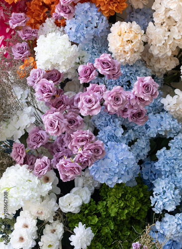 A variety of colorful flowers are gathered together.