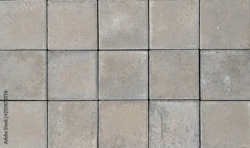 Obraz na plátně Top view close-up of grey square concrete paving slabs background texture, seamless outdoor stone floor tiles pattern for architectural design