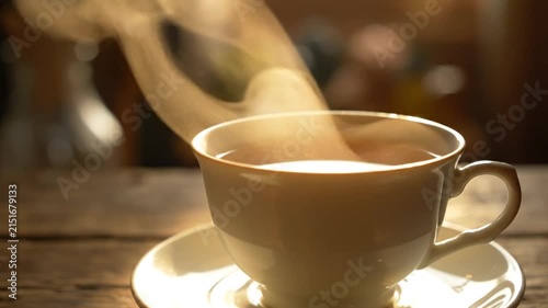 Steaming Hot Tea in White Cup on Wooden Table, Comforting Warmth Rising