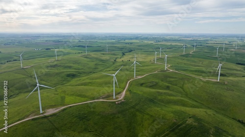 Aerial Wind Turbines Surrounded by Endless Green Hills
