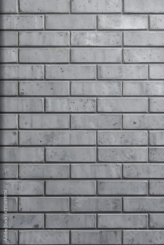 Clean gray brick wall background with repeating rectangular pattern and mortar background construction building