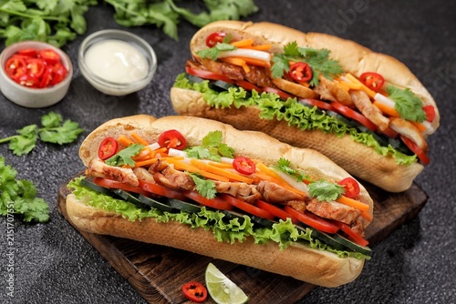 Banh mi is a French baguette filled with meat, chicken or pork with vegetables.