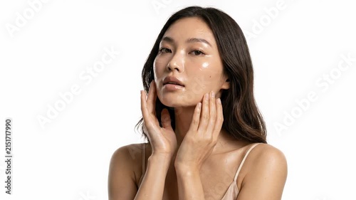 Serene young womans glowing, healthy skin beauty. Face touch reveals confident, young beauty, touch of pure bliss. Radiant face, gentle skincare, touch reveals serene self care, sophisticated
