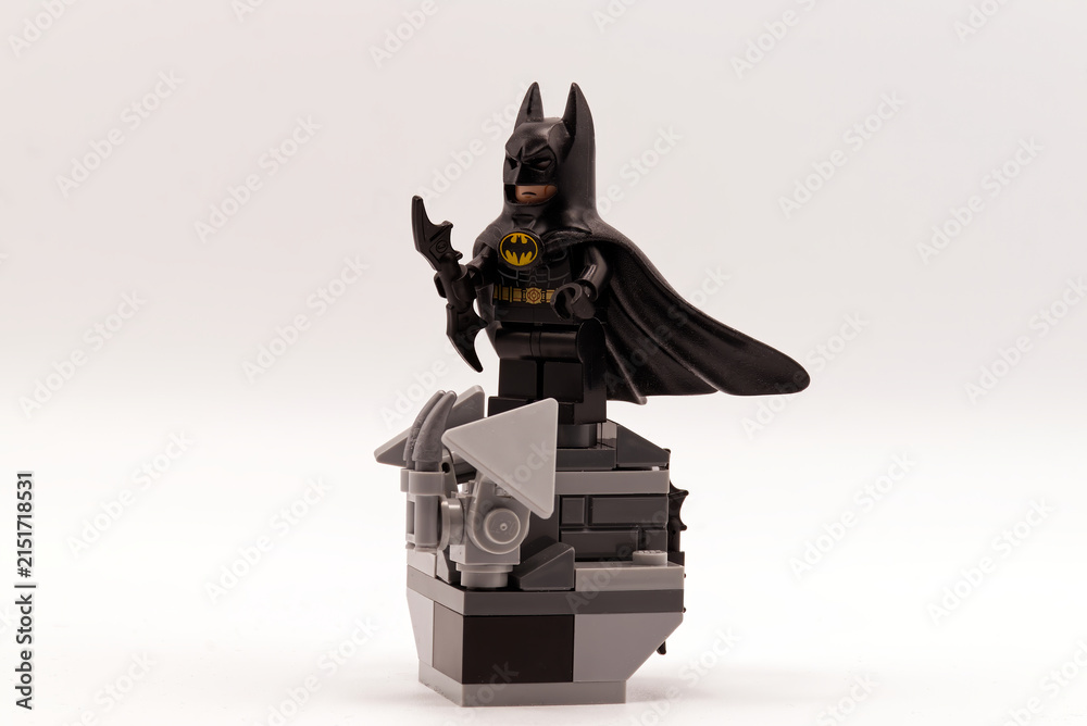 Fototapeta premium Bologna - Italy - August 9, 2026: Batman lego standing on a brick pedestal isolated on a white background.