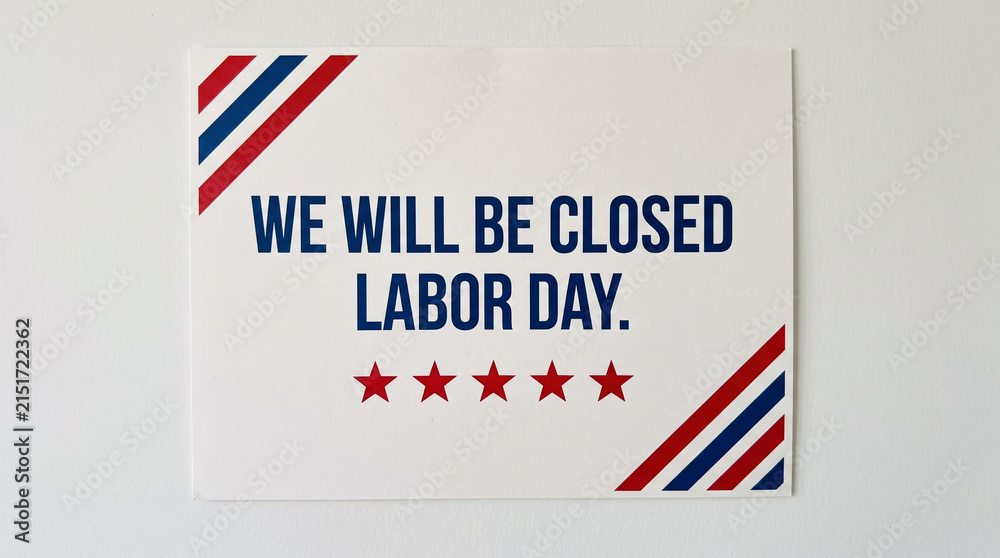 Fototapeta premium Signage announcement for business closure on Labor Day with patriotic stripe accents.
