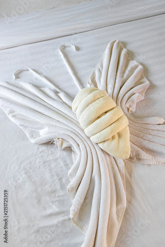 Towel Butterfly With Tropical Flower On Hotel Bed In Thai Hotel Room.
