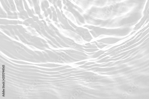 Black and white abstract water ripple texture with light caustics