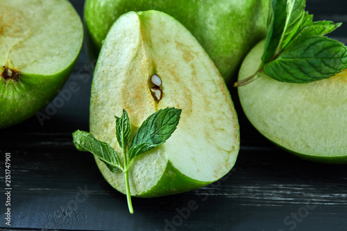 Healthy food background. The concept of healthy eating, fresh apples. On a black wooden background. Side view. Selective focus