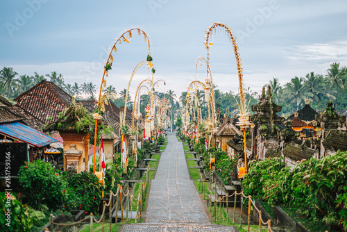 Balinese Penjor Decorations Along Paved Pathway, Bali, Indonesia