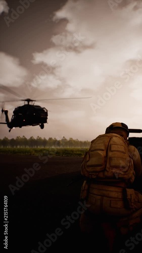 Vertical view of military battle tank, helicopter and soldiers on land with three fighter jets flying overhead, 3D animation