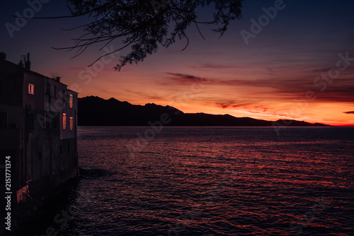 Wonderful colorful sunset reflecting in the sea in Saint-Florent in Corsica