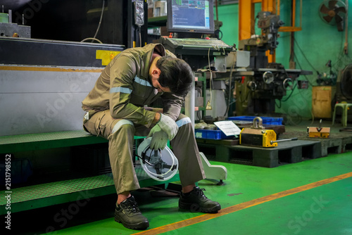 Принти на полотні Factory worker industrial workshop fatigue stress safety helmet overtime manufac