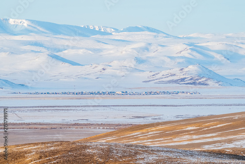 Adventure travel to Kokorya village in winter Chuya steppe, Altai mountains, Russia.