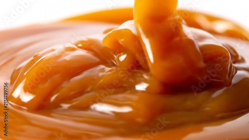 Viscous sweet liquid pouring and swirling in a smooth motion