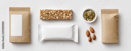 Flat lay of various food packaging, including granola bar, nuts, and spices