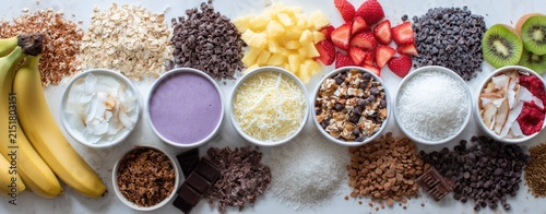 Array of toppings for customizable frozen yogurt or smoothie bowls