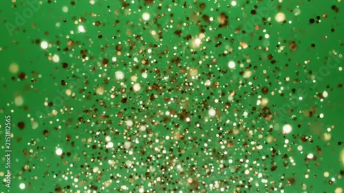 Golden Glitter Exploding Against Green Background with Cinematic Motion