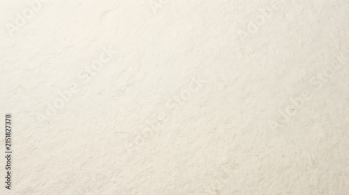 Handcrafted textured white paper background with subtle organic fibers and soft natural lighting