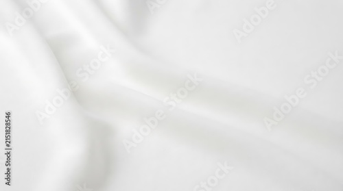 Soft white sheer fabric texture close-up for elegant seamless backdrop or design material